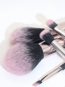 7-piece professional makeup brush set with ultra-soft pink and black bristles for flawless application