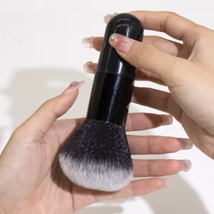 Professional large makeup brush with soft dense bristles for powder foundation and setting.