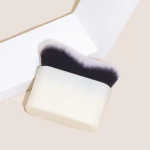 Professional flat top wave foundation brush with white base handle for smooth liquid makeup.