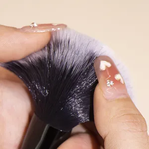 Close-up detail of soft synthetic makeup brush bristles showing fine density and texture.