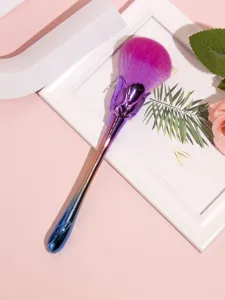 Detailed view of the gradient rose makeup brush with soft bristles and vibrant pink brush head.
