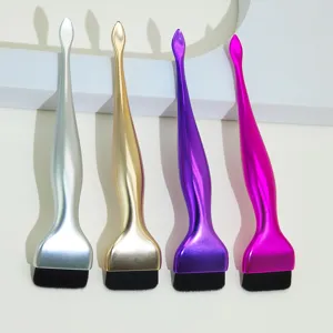 Detailed view of professional flat foundation makeup brush with metallic handle and soft bristles.
