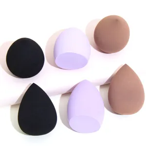 Close-up set of six non-latex makeup blender sponges in teardrop and slanted cut shapes.