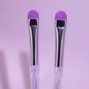 Set of 2 professional purple eyeshadow makeup brushes with crystal handle for precise blending.