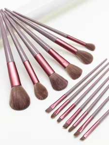 Detailed view of makeup brush set featuring soft bristles, rose gold ferrules, and handles.