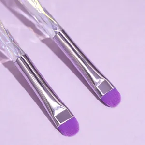 Crystal handle makeup brush set with soft purple eyeshadow detail applicator tools.