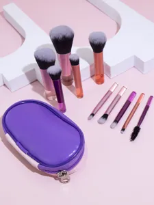 Mini makeup brush set detail view showing soft bristles and portable purple storage pouch.