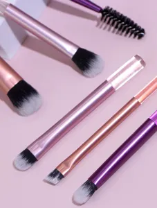 Detailed view of mini makeup brush set with crystal and metallic handles for daily travel.
