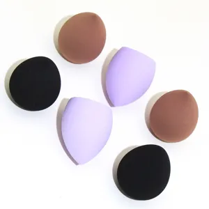 Detail view of six makeup sponges in black, purple and brown for smooth facial foundation.