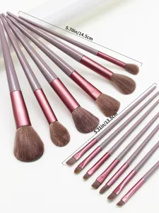 Detailed view of the 13-piece makeup brush set featuring soft brown bristles and pink handles.