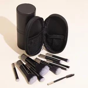 Mini travel makeup brush set with 10 pieces and portable black leather storage case detail.