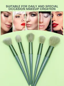 Detail view of green makeup brush set showing soft bristles and daily makeup inspiration.