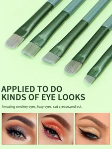 Detailed angled eye makeup brushes set closeup showing soft bristles and various eye looks.