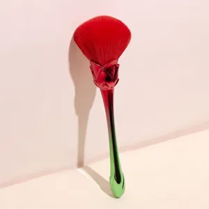 Gradient rose makeup brush with soft bristles, large loose powder and blush application.
