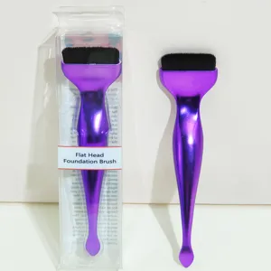 Flat head foundation brush with clear packaging box, purple handle and soft black bristles.