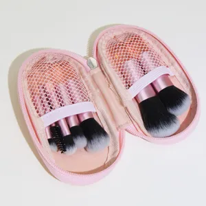 Mini 10-piece makeup brush set with portable pink zipper storage case for travel.