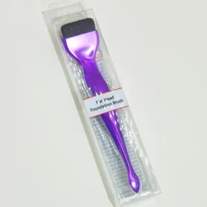 Purple flat head foundation brush with spoon handle for smooth makeup application details.