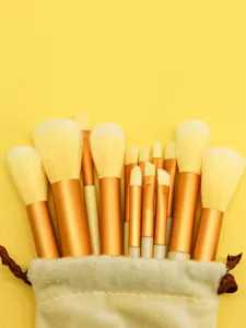 Detailed view of professional makeup brush set with metallic handles and soft bristles.