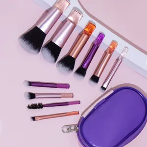 Portable 10-piece mini makeup brush set with purple storage bag, crystal handle cosmetic tools.