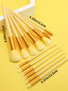 13-piece makeup brush set with soft bristles, light yellow handles, and gold ferrules.