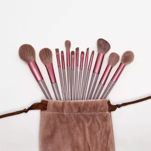 13-piece makeup brush set with pink velvet pouch, soft bristles for professional facial makeup.