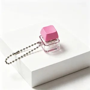 Cute pink mechanical keyboard switch keychain stress relief toy portable fidget clicker.