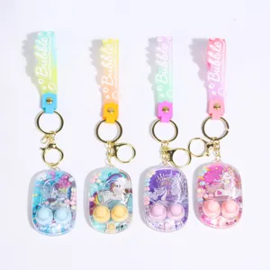 Mini handheld water ring toss keychain detail, cute cartoon unicorn design with colorful straps.