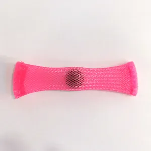 Close up detail of a pink fidget toy marble mesh tube, flexible stress relief sensory item.