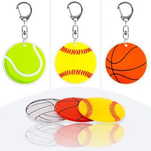 Acrylic sports keychain detail view showing clear basketball tennis and softball patterns.