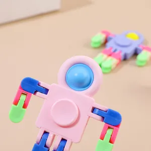 Close-up detail of multi-jointed transformable astronaut fidget toy with pop bubble design.