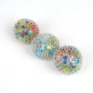 Detailed view of colorful sensory stress relief balls with soft spikes and beads inside.