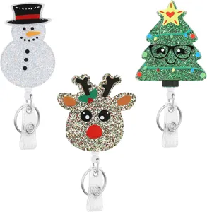 Close-up of Christmas glitter acrylic badge reel with snowman, reindeer and tree designs.