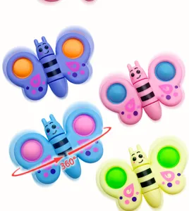 Vue détaillée de jouets colorés de toupie papillon anti-stress avec bulles à presser, multicolore.