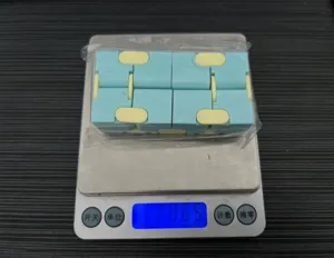 Detailed view of the mini infinity fidget cube in macaron colors, showing weight on scale