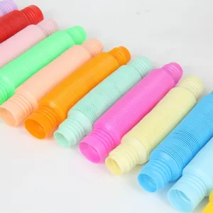Close-up detail view of colorful pop tubes, flexible plastic sensory fidget toy parts.