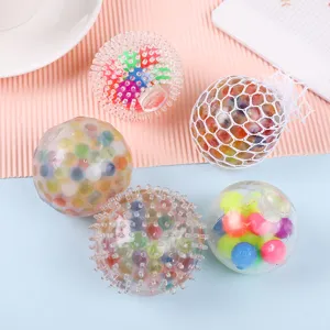 Detail view of colorful stress relief balls and mesh squeeze toys filled with water beads.