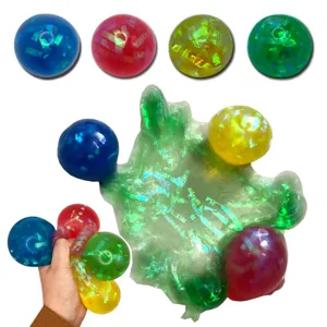 Colorful glitter stress relief ball detail view, flexible squeeze toy with shiny sequins.