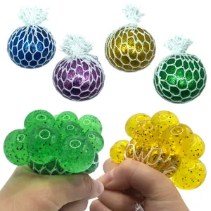 Colorful glitter mesh squeeze ball stress relief toy for sensory fun and hand relaxation.