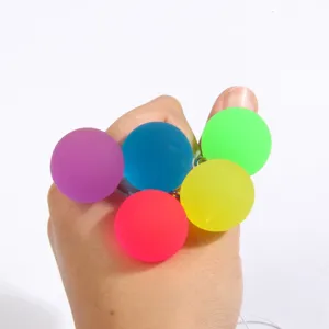 Colorful rubber bouncing balls with strings, classic fun hand toy, elastic jump balls set.