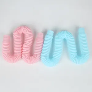 Close-up detail view of colorful plastic stretch tubes, flexible corrugated pop tube toy design.