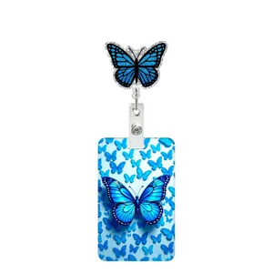 Close-up detail shot of the vibrant blue butterfly ID badge reel and matching card holder.