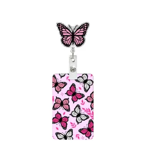 Close-up of retractable badge reel and ID card holder featuring cute pink butterfly print.