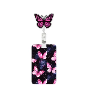 Retractable badge reel with pink glitter butterfly design and matching card holder for ID cards.