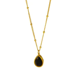 Detailed view of the elegant gold teardrop pendant and delicate beaded chain design.