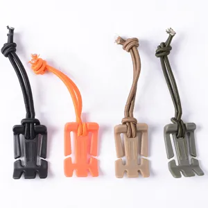 Outdoor multi-functional strap clip with elastic cord for backpack webbing organization.