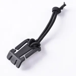 Outdoor backpack strap fastener with black elastic bungee cord for tactical gear organization.