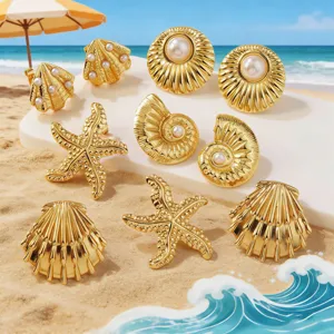 Golden marine style shell starfish pearl earrings set, perfect beach vacation detail shot.