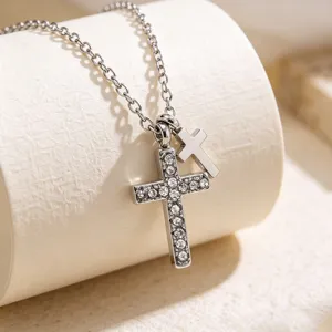 Stainless steel double cross pendant necklace featuring sparkling rhinestones and delicate chain.