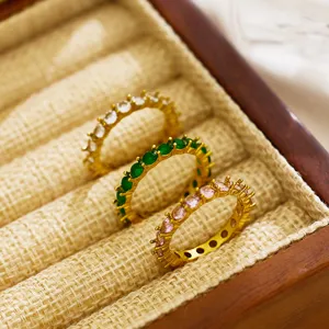 Detailed close-up of gorgeous 18k gold plated titanium steel full zircon eternity rings.