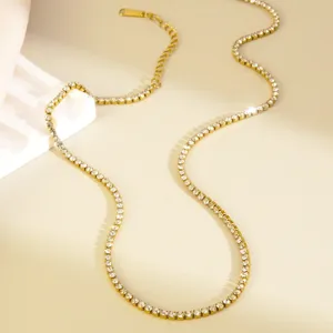 Gold stainless steel rhinestone tennis chain necklace, elegant minimalist detail shot for women.